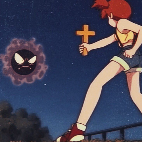 Misty holding a cross